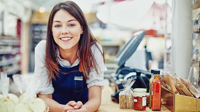 Small Business Saturday female shop owner smiling